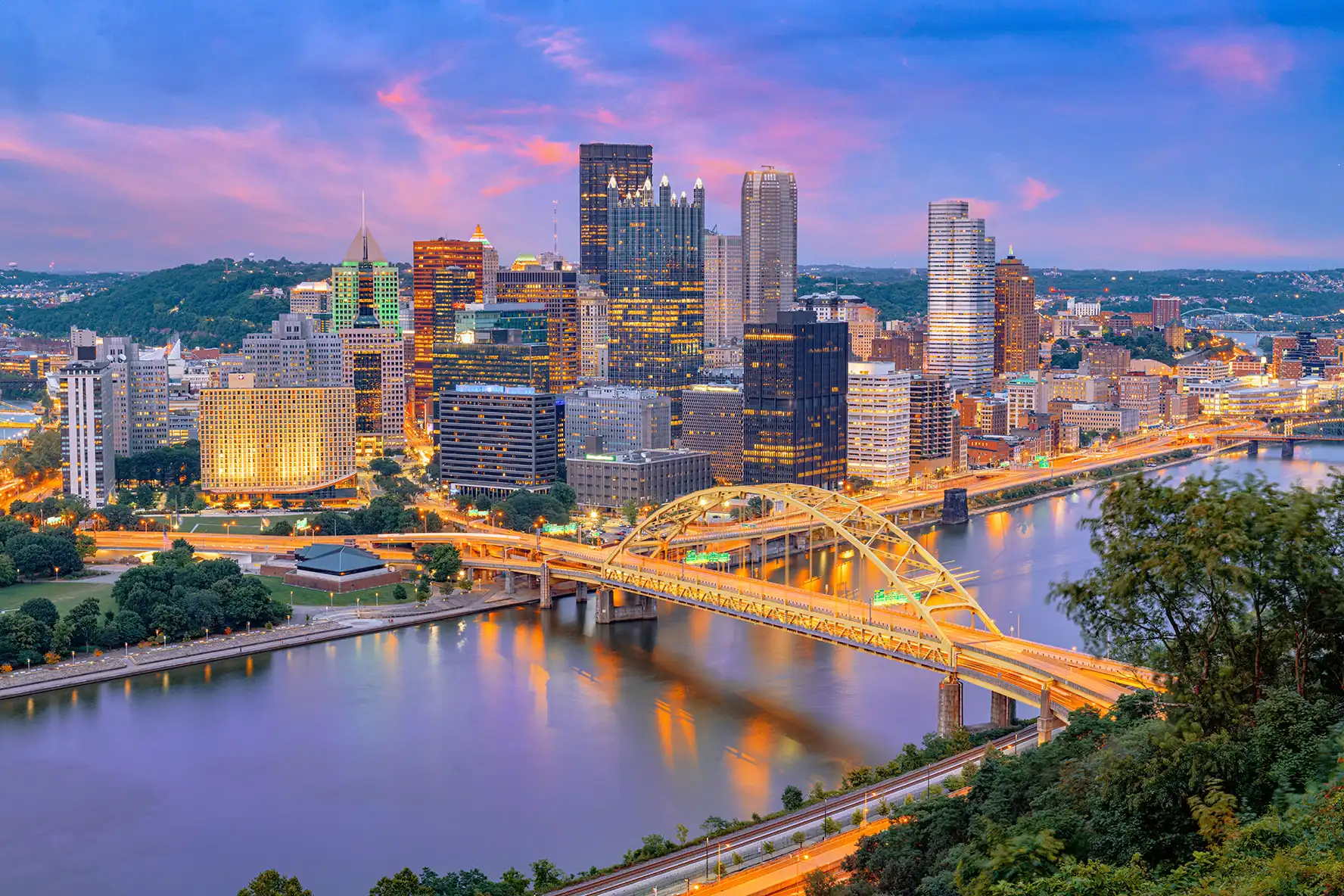 Pittsburgh skyline at sunset with the Fort Pitt Bridge